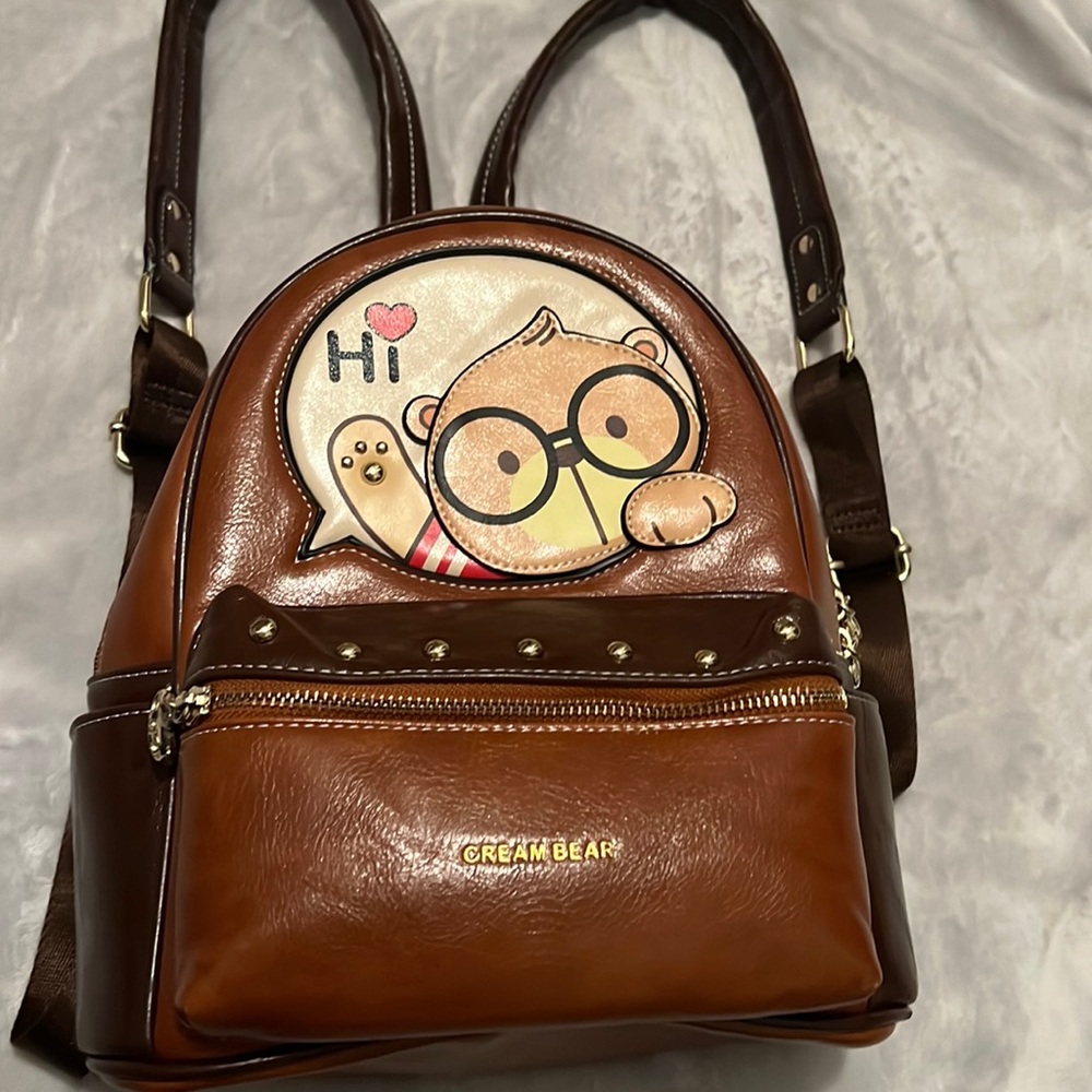 Cream Bear mini backpack. Brown leather with multiple pockets! Great condition!